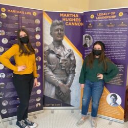 two girls in front of exhibit panels about Martha Hughes Cannon