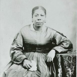Black woman seated for a photograph