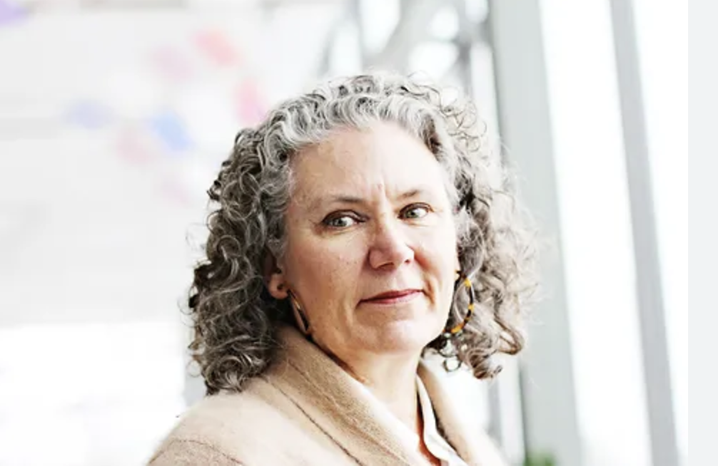 Photo of Utah Poet Laureate Lisa Bickmore, white woman with gray curly hair.